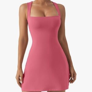 Never worn! Cute comfortable dress made of Nylon/Spandex, w/a built in slip.